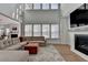 Bright living room with fireplace and large windows offering lots of natural light at 4409 Encore Park Lane, Duluth, GA 30097