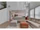 Open-concept living room with hardwood floors and a view into the kitchen at 4409 Encore Park Lane, Duluth, GA 30097