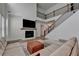 Cozy living room with a fireplace and staircase at 4409 Encore Park Lane, Duluth, GA 30097