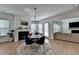 Open living space showcases dining area, fireplace, and seamless flow to living room for easy entertaining at 4409 Encore Park Lane, Duluth, GA 30097