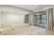 Open basement area with sliding glass doors leading to outdoor patio, and lots of natural light at 45 Willow Ne Gln, Atlanta, GA 30342