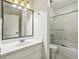 Cozy bathroom with white vanity and enclosed shower-tub combo at 45 Willow Ne Gln, Atlanta, GA 30342