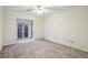 Bedroom featuring soft carpeting, natural light from the window, and neutral wall paint at 45 Willow Ne Gln, Atlanta, GA 30342