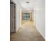 Bright hallway with multiple doors and an outdoor patio visible at the end at 45 Willow Ne Gln, Atlanta, GA 30342