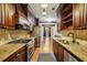 A spacious kitchen with stainless steel appliances, granite countertops, and wood cabinetry at 45 Willow Ne Gln, Atlanta, GA 30342