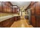 Traditional kitchen features dark wood cabinetry, granite countertops, and stainless steel appliances at 45 Willow Ne Gln, Atlanta, GA 30342
