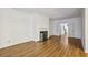 Bright living room featuring wood floors and a white fireplace with black marble hearth at 45 Willow Ne Gln, Atlanta, GA 30342