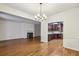 Open living room featuring wood floors, fireplace, and an open doorway to the kitchen at 45 Willow Ne Gln, Atlanta, GA 30342