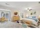 Spacious primary bedroom with a ceiling fan, sitting area, and access to a private balcony at 45 Willow Ne Gln, Atlanta, GA 30342