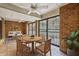 Enclosed patio features brick flooring, cozy seating, and ample natural light at 45 Willow Ne Gln, Atlanta, GA 30342