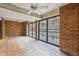 Covered brick patio with a ceiling fan and wrought iron gate at 45 Willow Ne Gln, Atlanta, GA 30342