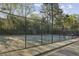 Community tennis court with a new fence and landscaping at 45 Willow Ne Gln, Atlanta, GA 30342