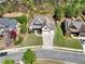Aerial view of home with mature trees, well-manicured lawn and long driveway at 453 Thorn Creek Way, Dallas, GA 30157