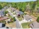 Overhead view of a tree-lined neighborhood and landscaped homes at 453 Thorn Creek Way, Dallas, GA 30157