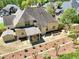 Aerial view of the property showing the covered patio, storage shed, landscaping, and fencing at 453 Thorn Creek Way, Dallas, GA 30157