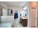 Bathroom featuring a tiled shower and tub with granite countertops and a dark wood vanity at 453 Thorn Creek Way, Dallas, GA 30157