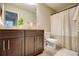 Bathroom featuring a toilet, dark wood vanity, and a shower with a curtain at 453 Thorn Creek Way, Dallas, GA 30157