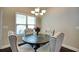 Bright breakfast nook featuring a round table, comfortable chairs, and a large window at 453 Thorn Creek Way, Dallas, GA 30157