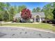 Charming clubhouse featuring stone accents, covered porch, and well-manicured landscaping at 453 Thorn Creek Way, Dallas, GA 30157