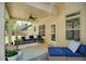 Inviting covered patio with comfortable seating, ceiling fan, and view of the backyard at 453 Thorn Creek Way, Dallas, GA 30157