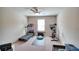 Gym featuring a ceiling fan, carpet, and exercise equipment at 453 Thorn Creek Way, Dallas, GA 30157