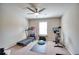 Gym featuring a ceiling fan, carpet, and exercise equipment at 453 Thorn Creek Way, Dallas, GA 30157