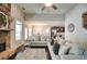 Inviting living room with hardwood floors, stone fireplace, and open to the kitchen and dining area at 453 Thorn Creek Way, Dallas, GA 30157