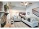 Cozy living room with stone fireplace, hardwood floors, and bright, open floorplan at 453 Thorn Creek Way, Dallas, GA 30157