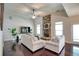 A spacious living room with a soaring ceiling, hardwood floors, and a stone fireplace at 453 Thorn Creek Way, Dallas, GA 30157