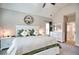 Main bedroom boasts a vaulted ceiling, plush bed, bright windows and access to the en-suite bathroom at 453 Thorn Creek Way, Dallas, GA 30157