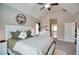 A primary bedroom with a vaulted ceiling, bright windows, and an en-suite bathroom at 453 Thorn Creek Way, Dallas, GA 30157