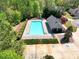 Aerial view of the community pool featuring ample lounging space and adjacent clubhouse at 453 Thorn Creek Way, Dallas, GA 30157