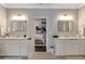 Bathroom with marble countertops, double vanity sinks, and a view into an adjacent bedroom at 60 Spence Se Ave, Atlanta, GA 30317