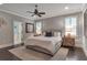 Comfortable bedroom with a neutral color scheme, features a large bed, bedside tables, and shuttered windows at 60 Spence Se Ave, Atlanta, GA 30317