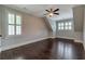 Spacious bedroom featuring hardwood floors, crown molding, plantation shutters, and natural light at 60 Spence Se Ave, Atlanta, GA 30317