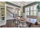 Stylish dining room with built-in shelving, a modern table setting, and natural light from large windows at 60 Spence Se Ave, Atlanta, GA 30317