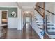 Inviting foyer with hardwood floors, classic wainscoting, and staircase leading to upper level at 60 Spence Se Ave, Atlanta, GA 30317