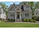 Charming gray two-story home featuring a well-manicured lawn and traditional architectural details at 60 Spence Se Ave, Atlanta, GA 30317