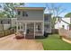 Charming home exterior with a spacious deck, well-manicured lawn, and lush landscaping, perfect for outdoor living at 60 Spence Se Ave, Atlanta, GA 30317