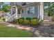 Lovely gray home with lush landscaping, a brick walkway, and a private driveway for easy access at 60 Spence Se Ave, Atlanta, GA 30317