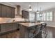 Modern kitchen featuring a granite island with seating and stainless steel range at 60 Spence Se Ave, Atlanta, GA 30317