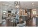 Open concept living room and kitchen with hardwood floors and a fireplace at 60 Spence Se Ave, Atlanta, GA 30317