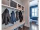 Mud room features built in storage and bench with blue accent wall at 60 Spence Se Ave, Atlanta, GA 30317