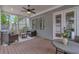 Inviting covered porch with stylish seating, ceiling fan, and natural light, perfect for outdoor relaxation at 60 Spence Se Ave, Atlanta, GA 30317
