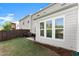 Grassy backyard with a small patio area at 216 Ellis Ln, Woodstock, GA 30189