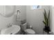 Modern half bath with a bright white brick wall, decorative mirror, and sleek fixtures at 216 Ellis Ln, Woodstock, GA 30189
