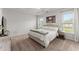 Calm bedroom with a neutral color palette, featuring two windows and soft carpet at 216 Ellis Ln, Woodstock, GA 30189