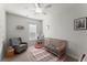 Bedroom with an area rug, gray armchair, blinds, and wood crib at 216 Ellis Ln, Woodstock, GA 30189