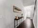 Inviting entryway features dark hardwood floors and a console table, creating a warm welcome at 216 Ellis Ln, Woodstock, GA 30189