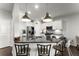Modern kitchen featuring granite countertops, stainless steel appliances, and pendant lighting at 216 Ellis Ln, Woodstock, GA 30189